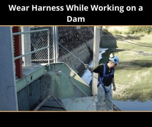 Wear Harness While Working on a dam